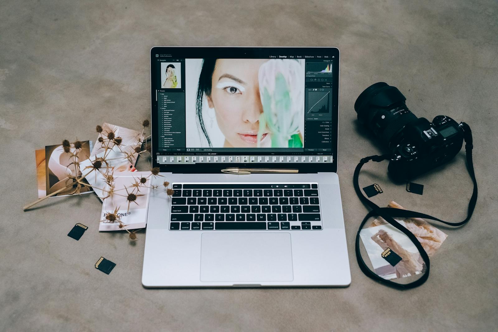 Photo editing workflow on a laptop showing color correction sliders for high-quality image processing